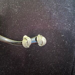 Vintage silver tone twist design clip on textured earrings.